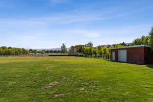 View of yard with a mountain view and an outbuilding