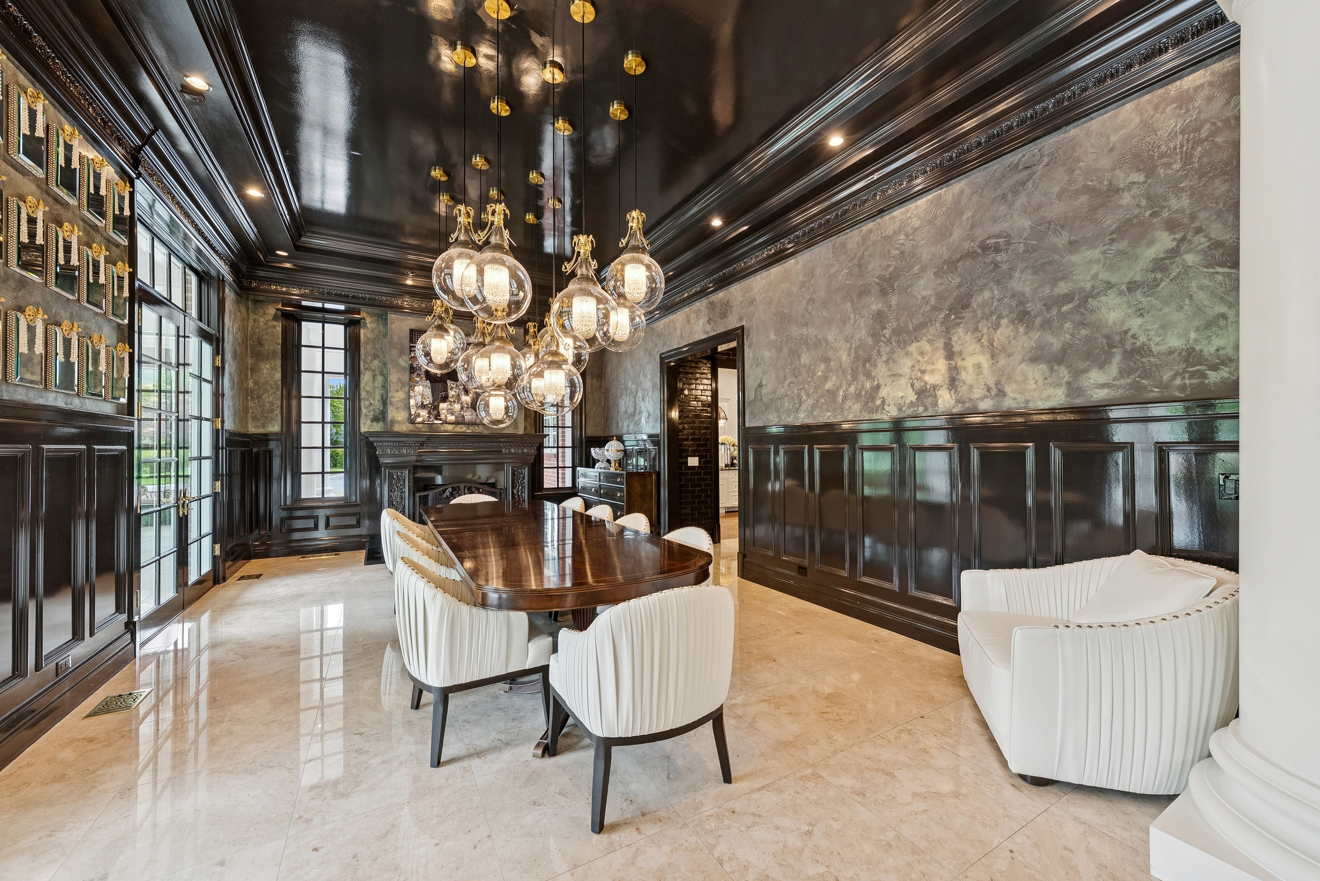 Formal dining area featuring a polished wood-finish dining table and light-toned tile flooring
