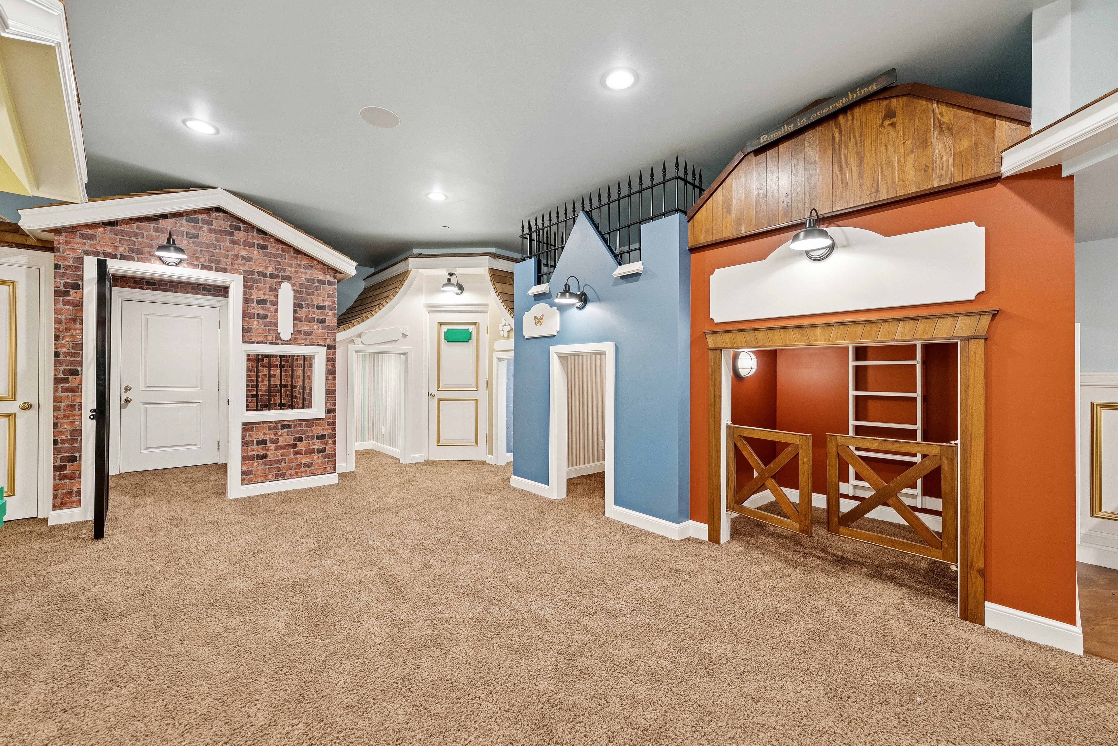 Dedicated indoor play space featuring multiple themed structures