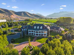 View from above of property with a mountain backdrop