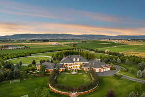 Aerial view at dusk of a view of countryside, a mountain view, and agricultural area