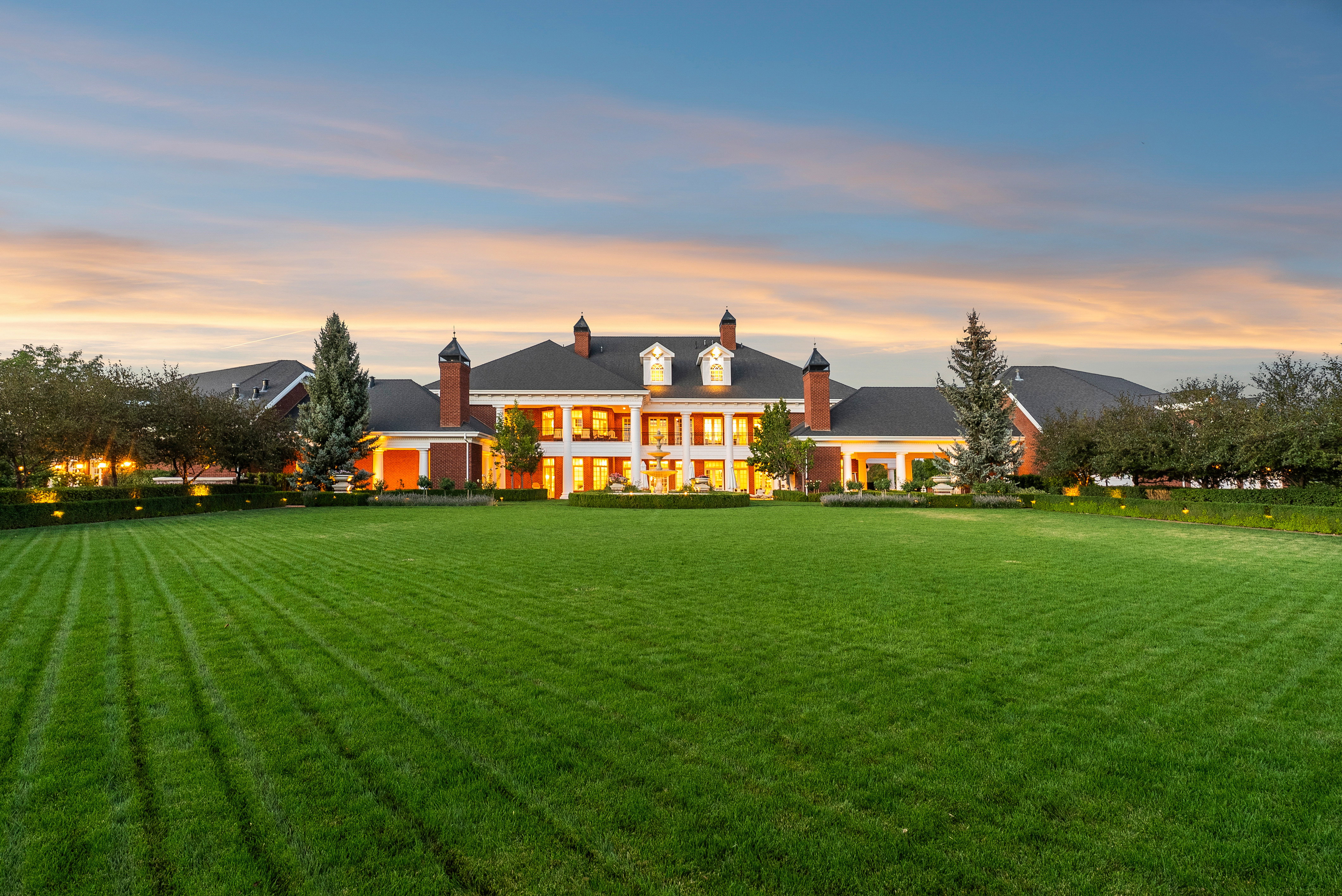 Expansive front lawn with manicured turf