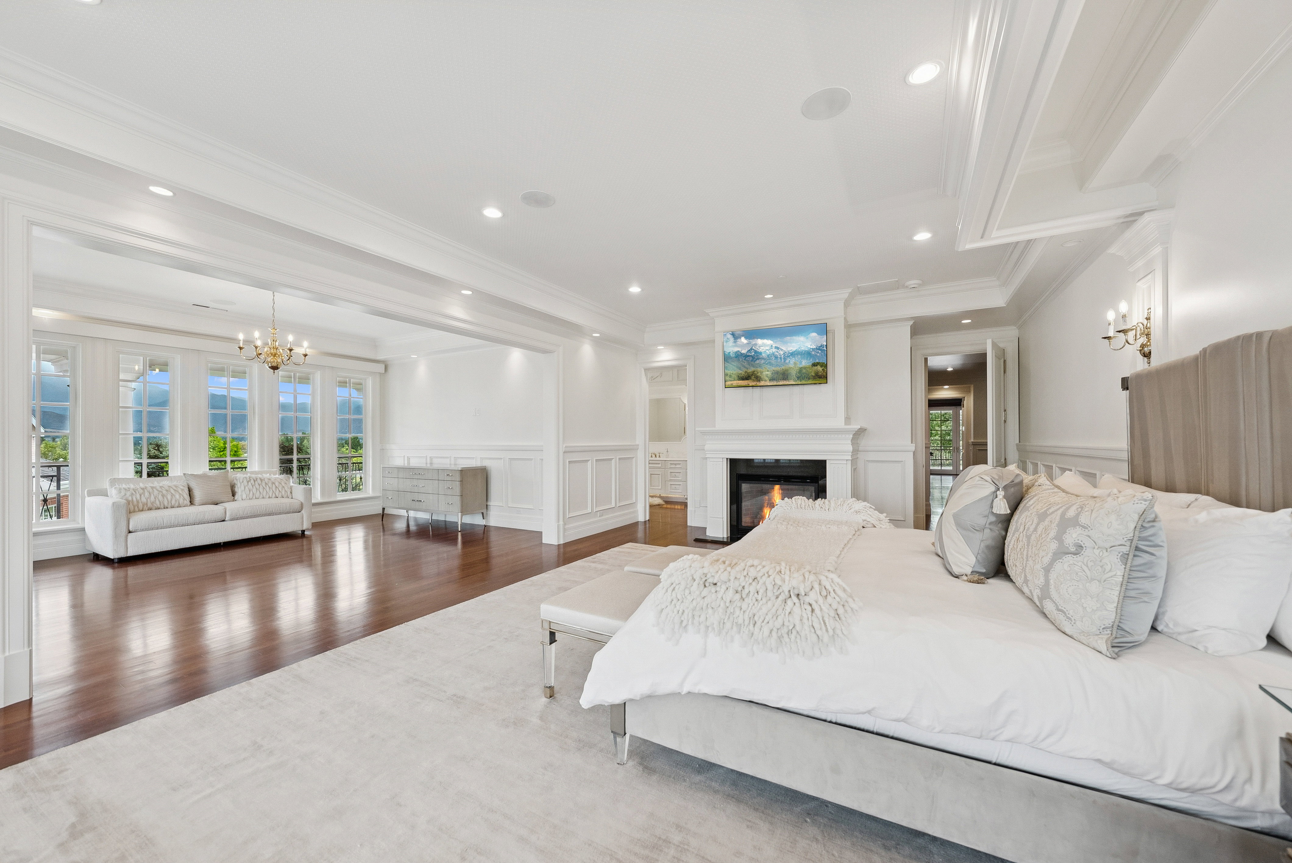 Spacious room featuring a fireplace with a mantel, recessed lighting, and a coffered ceiling