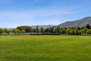 Surrounding community with a mountain view and a view of countryside