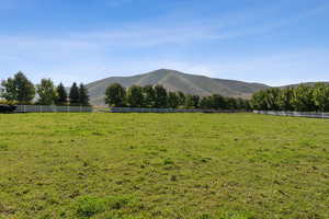 View of mountain background featuring rural landscape