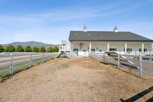 Horse barn featuring a mountain view