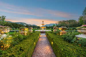 View of home's community with a mountain view and a patio
