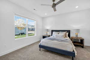 Bedroom featuring carpet floors, a ceiling fan, and recessed lighting