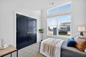 Bedroom with carpet floors and a closet