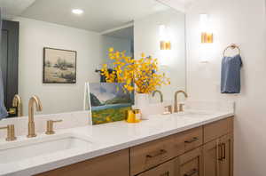 Full bath featuring double vanity and recessed lighting