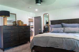Bedroom featuring light colored carpet and ceiling fan