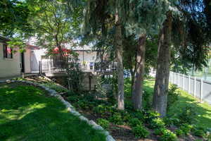 View of yard with a wooden deck