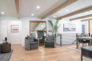 Community lobby featuring beamed ceiling and recessed lighting