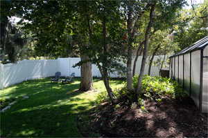 View of fenced backyard