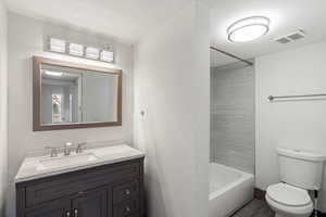 Bathroom featuring  shower combination and vanity