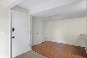 Interior space with light wood-type flooring and light carpet