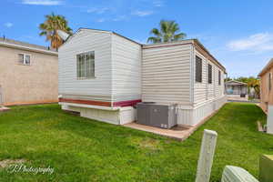 View of home's exterior with a lawn