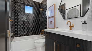 Bathroom with shower / bathtub combination and vanity