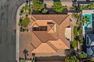 Aerial view of property and surrounding area with a pool