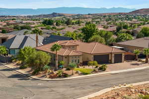 Aerial perspective of suburban area featuring a mountainous background