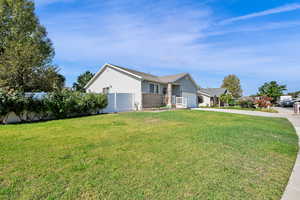 View of home's exterior featuring concrete driveway, brick siding, and an attached garage