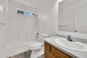 Full bathroom featuring shower / bath combination, vanity, and LVP flooring