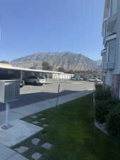 View of green lawn with a mountain view
