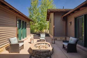 View of patio / terrace with a fire pit