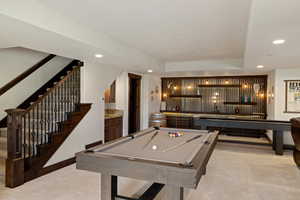 Recreation room with pool table, light colored carpet, recessed lighting, and a tray ceiling