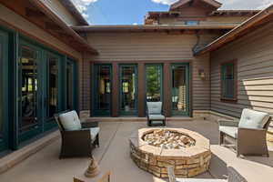 View of patio / terrace with an outdoor fire pit and french doors