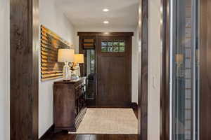 Foyer featuring wood finished floors and recessed lighting