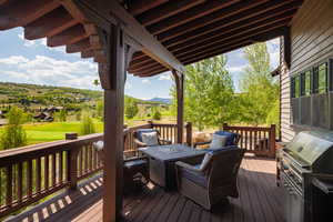 Deck featuring grilling area and a mountain view