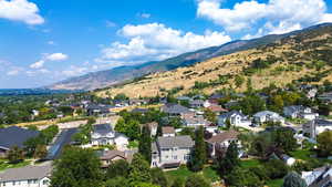 Aerial view of residential area featuring a mountain backdrop