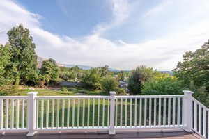Wooden terrace featuring a mountain view