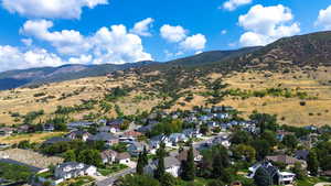 Aerial perspective of suburban area with a mountainous background