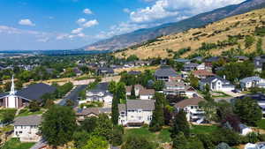 View of property location featuring a mountainous background and nearby suburban area