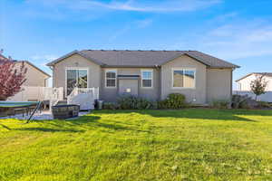 Rear view of property featuring a patio area, stucco siding, and roof with shingles