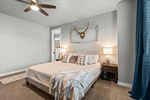 Bedroom with carpet flooring and a ceiling fan