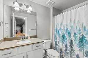 Full bath featuring vanity and a shower with curtain