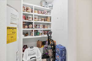 Storage area with water heater and electric panel