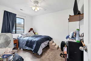 Bedroom featuring carpet floors and ceiling fan