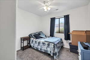 Bedroom with carpet and ceiling fan
