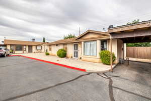 Ranch-style house with stucco siding