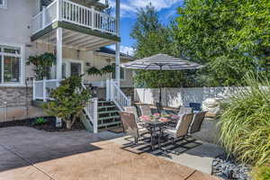 Patio / terrace featuring a patio area, outdoor dining space, and stairs