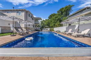 View of swimming pool featuring a patio