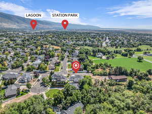 Aerial perspective of suburban area featuring a mountain backdrop