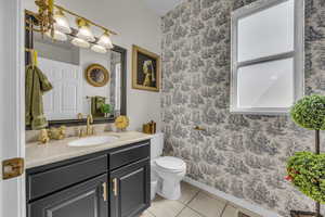 Bathroom with vanity and light tile patterned floors