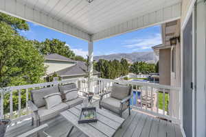 Deck with a mountain view and an outdoor hangout area