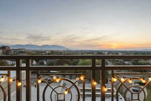 Balcony at dusk with a mountain view