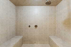 Bathroom featuring a tile shower